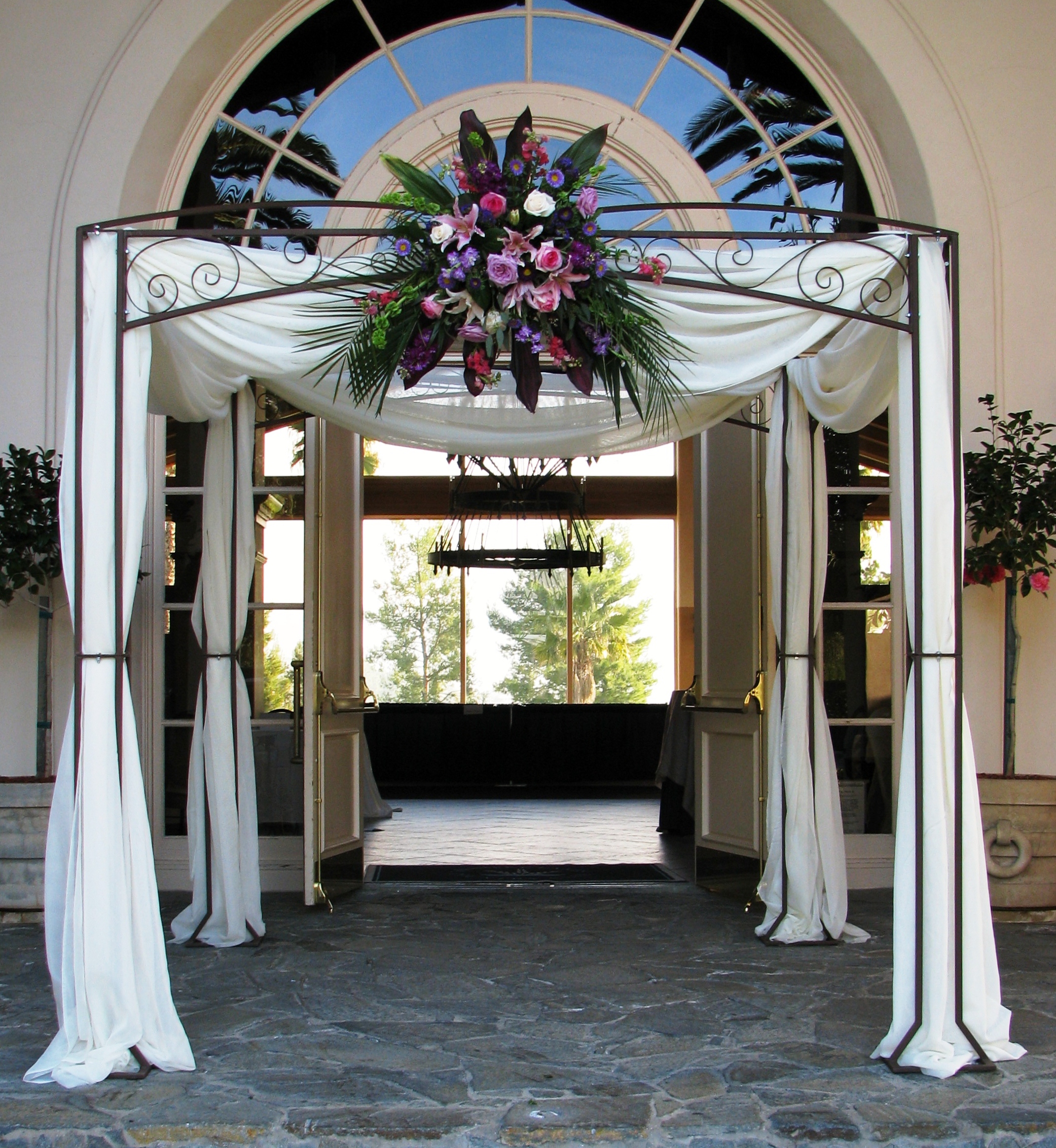Iron Chuppah with draping and flower